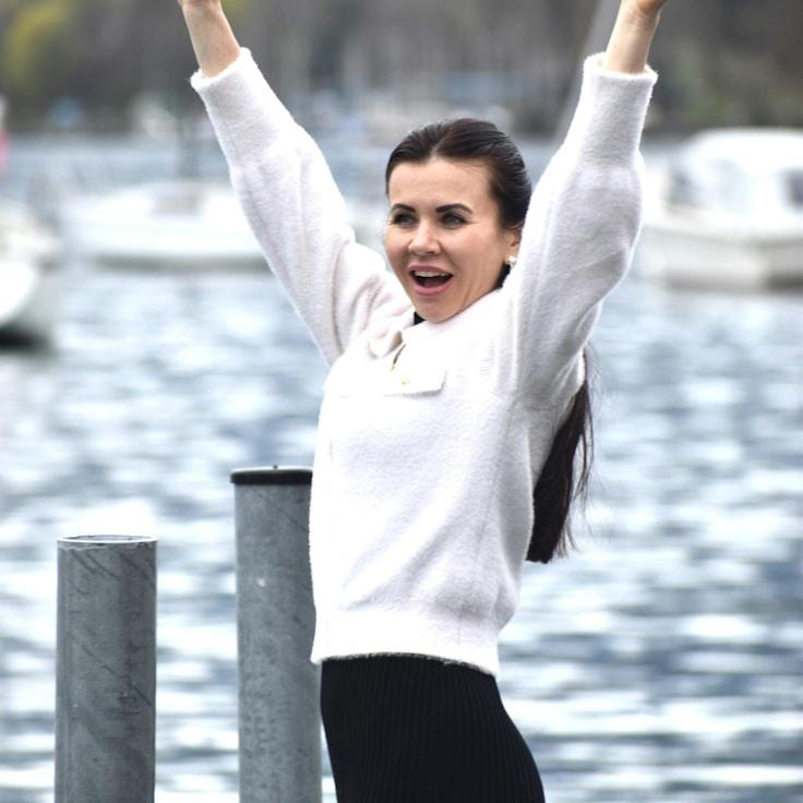 Kaveri Mehta, Lead Design Curator at TidePlumeCanyon, reviewing corporate floral arrangements